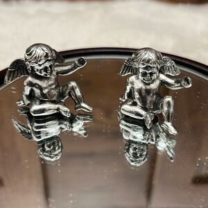 Set of 8 Cherub place settings, by universal pewter